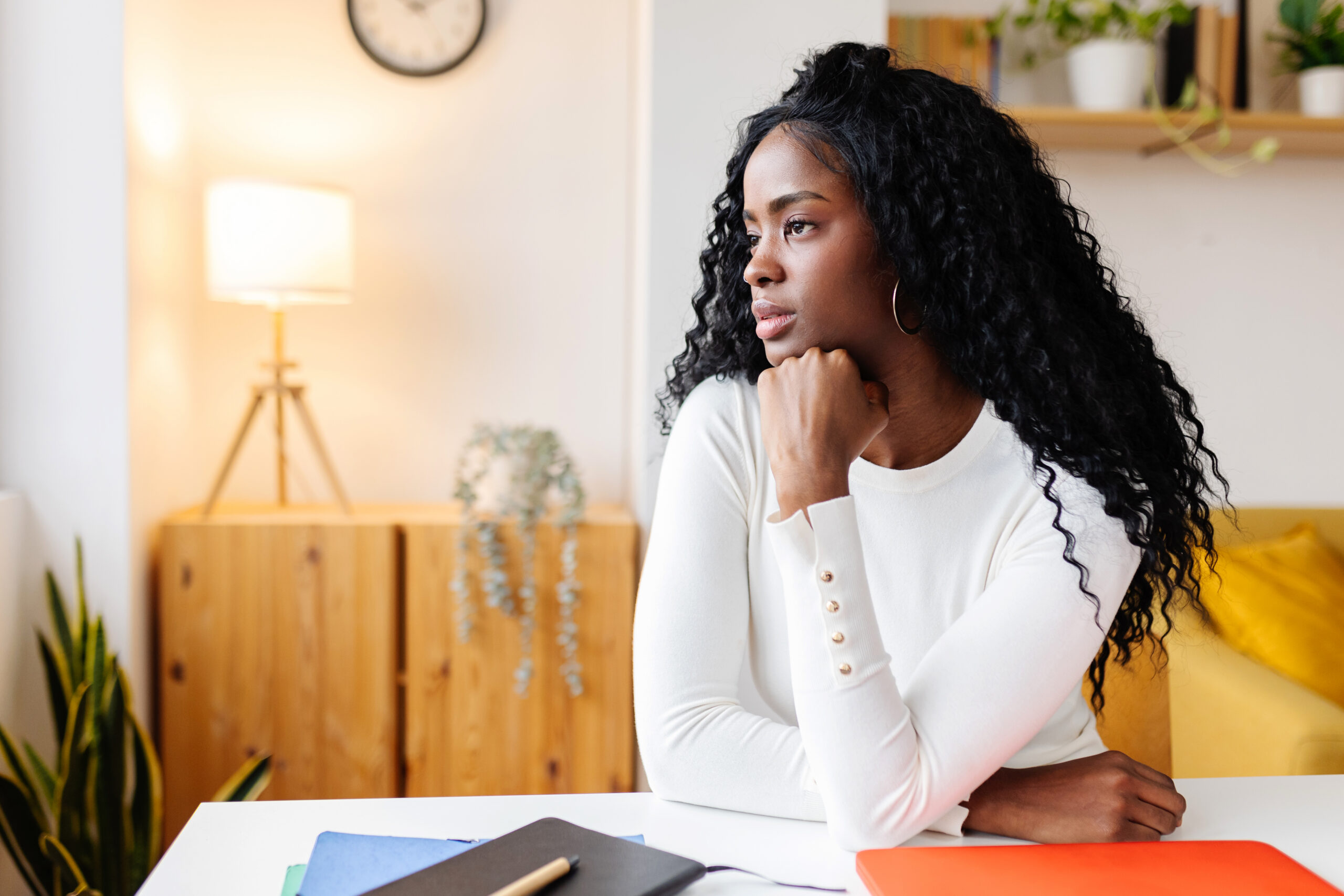 Female employee thinking about her career plan.